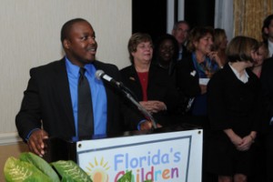 Former foster child Mez Pierre addresses attendees at the recent Florida's Children First event.